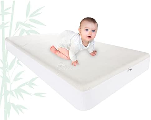 Pure Bamboo Crib Bamboo Mattress Protector - A almofada de capa de resfriamento respirável à prova d'água protege contra umidade, derramamentos, manchas - silencioso, lavável na máquina, se encaixa em 52 x28 x6 colchão de berço