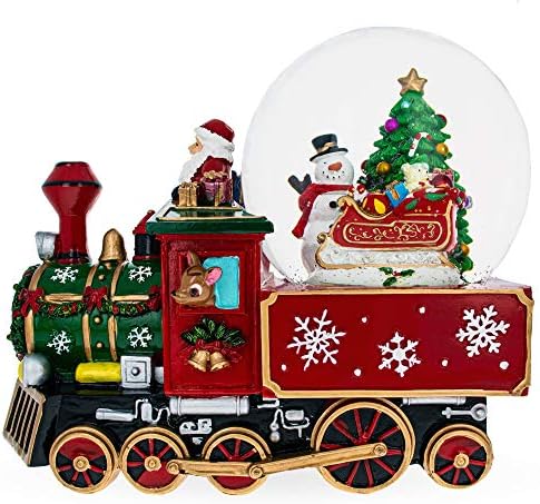 Papai Noel, boneco de neve e renas entregando árvores em um globo de água musical de trem
